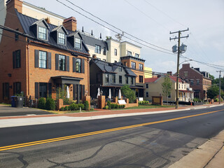 Fototapeta premium Residential street in historic town featuring classic architecture and calm suburban lifestyle