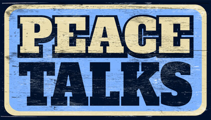 Aged and worn peace talks sign on wood