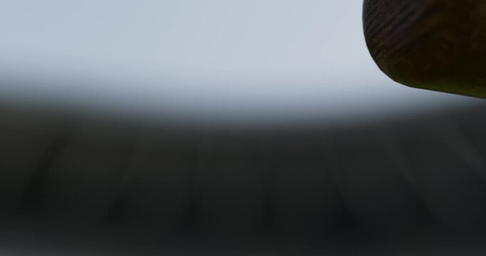 macro shot of a baseball bat hitting a ball