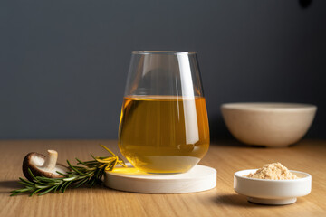 Golden adaptogenic mushroom elixir glows in a modern glass on rustic wood, surrounded by powder and shiitake, radiating natural wellness.
