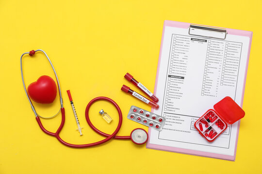 Blood samples of cortisol with stethoscope, pills and laboratory test form on yellow background. Medical concept