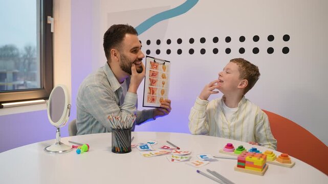 Speech therapist working with a child on articulation