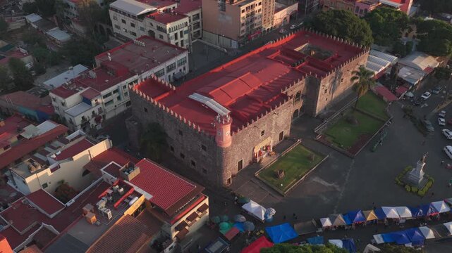 Static aerial shot of Palacio de Cort&eacute;s at sunset in Cuernavaca Z&oacute;calo