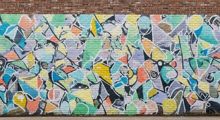 Naklejka premium Vibrant abstract graffiti art covering a textured brick wall with a variety of geometric shapes and colors