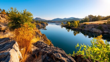 Obraz premium Serene Quarry Lake at Dawn with Still Surface Reflecting Vibrant Colors of Nature