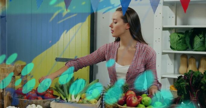 Vendor checking market stall, reaching for tomatoes, arranging leeks to sell with moving overlay