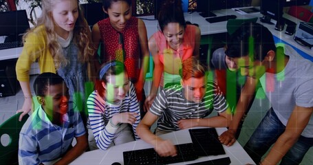 Huddling eight students leaning and pointing at monitor in school lab with keys green red overlay