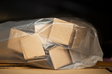 Cardboard boxes in a plastic bag 