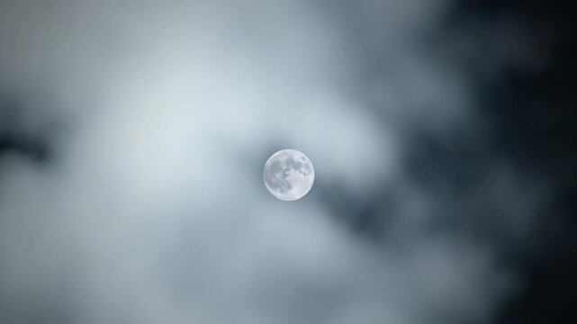 Full Moon Shining Through Clouds During Sacred Nights of Ramadan
