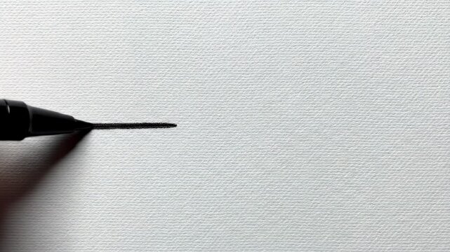 Line being drawn. A single clean line is drawn smoothly from left to right across a blank background.