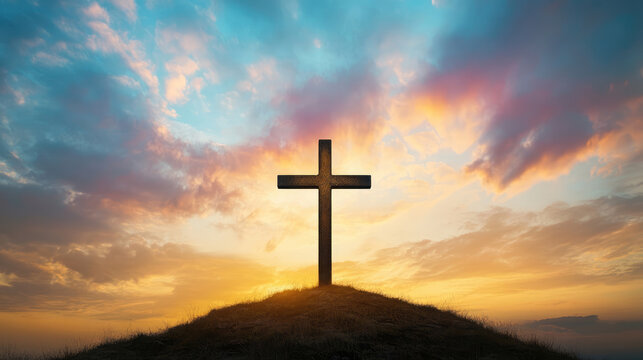 Christian cross on hill with dramatic sky background for easter and good friday remembrance concept