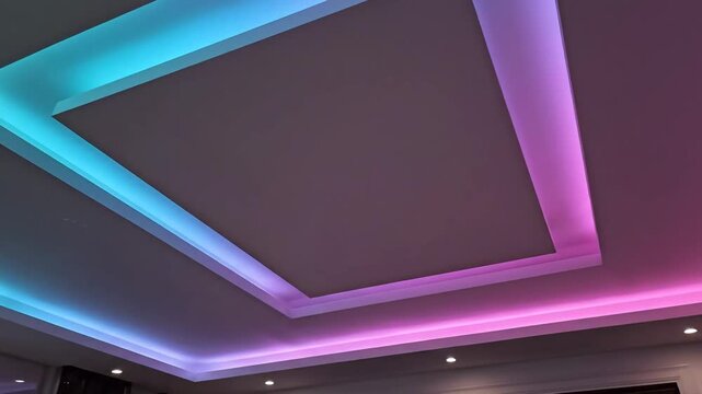 Modern ceiling design with colorful LED lights creating a vibrant atmosphere.