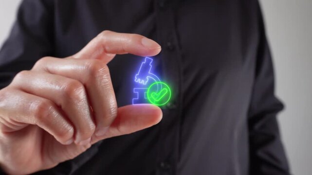 Lab results ready. Close-up of a woman's hands holding a virtual microscope icon with a check mark between her two fingers.