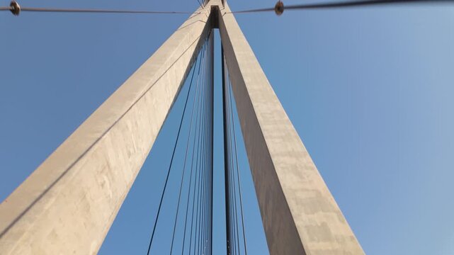 Towers And Steel Cables Of Helgeland Bridge (Helgelandsbrua) Against The Blue Sky In Norway. - low angle shot