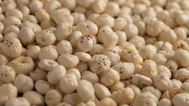 Makhana falling on tray closeup shot.