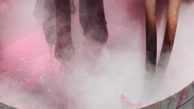 Dyeing fabric with lac to obtain natural colors using the ancient method of boiling in a hot pot.