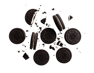 Scattered chocolate cookies with cream filling on transparent background isolated