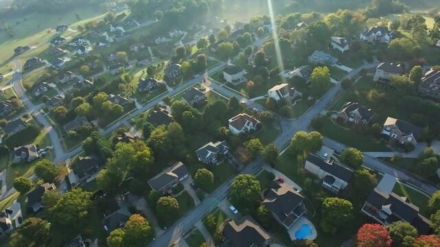 Johnson City, USA, Tennessee Aerial Neighborhood Bathed In Golden Sunlight With Sunbeams, Backyard Pools, Leafy Canopies, Long Shadows On Quiet Streets And DewKissed Lawns Ideal For Realty