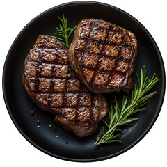 Two grilled steak medallions on dark plate, rosemary sprigs