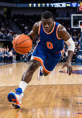 Naklejka premium Competitive Basketball Player Dribbling Ball Fast on Court: Concept of Athleticism, Professional Sports, Intense Game Action, and Determination