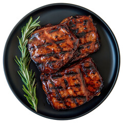 Glazed ribs with rosemary garnish on a black plate