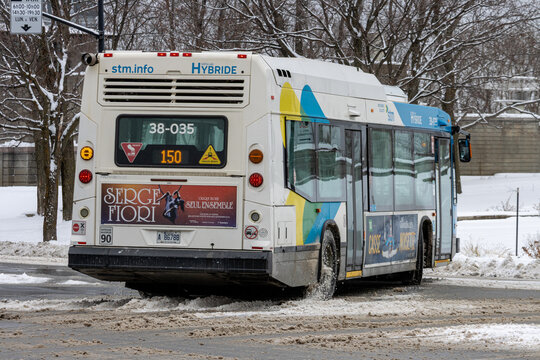 MONTREAL, CANADA, 25 December 2025 : City Bus in Snowy Weather, Hybrid Vehicle, Advertising Posters