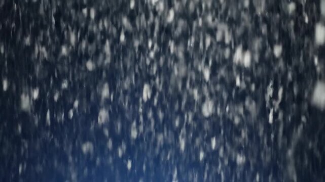 Blurry, dark, out-of-focus image with many small white dots sprinkled throughout