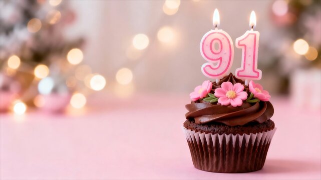 Chocolate cupcake with pink flowers and a 91 candle