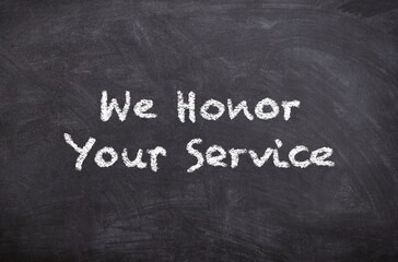 Hand drawn chalk sketch on blackboard with the text Honor Your Service for Veterans Day symbolizing respect gratitude and recognition for veterans