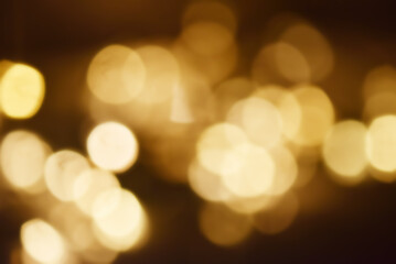 Fototapeta premium Abstract nature background with dreamy bokeh and soft colorful flower silhouettes in orange and teal.