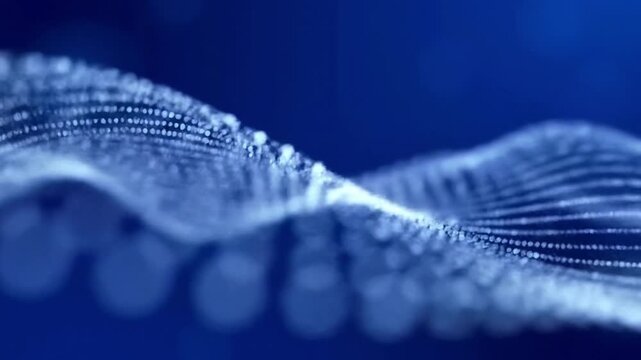 blue wave of glowing dots on dark background