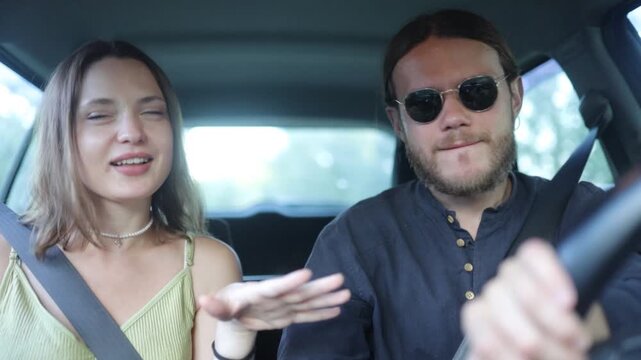 a couple in love are driving in a car and talking
