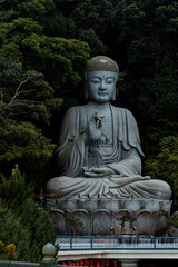 Chin swee caves temple buddha statue ,creating a contrast between spirituality and development