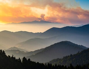 Obraz premium Sunset over a range of mountains; layered with a smoky haze