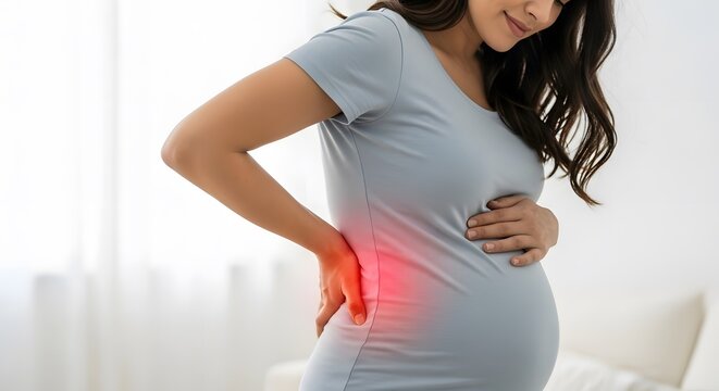 Pregnancy related back pain and spinal health. Maternal support and wellness concepts. Smiling pregnant woman holding her stomach and aching back at home