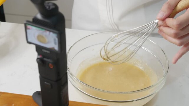 Food Content Creator Recording Cooking Video with Action Camera and Studio Lighting Setup