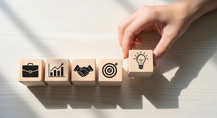 Hand places final block with idea lightbulb icon on desk