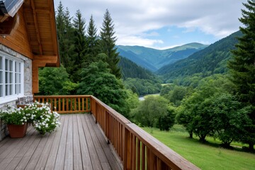 Obraz premium Wooden cabin balcony overlooking green mountain valley