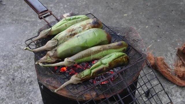 Grilled Eggplant on Charcoal Stove Street Food Barbecue Close Up Video Footage