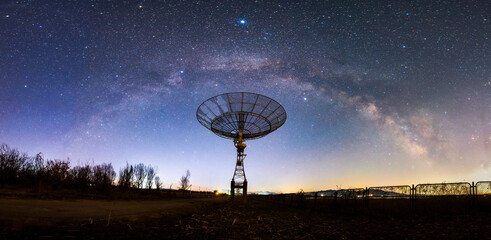 radio telescope on the background of stellar tracks, The observatory's radio telescope © zhengzaishanchu