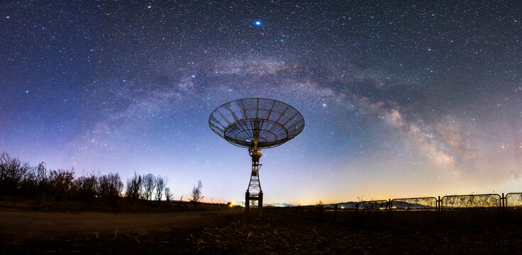 radio telescope on the background of stellar tracks, The observatory's radio telescope