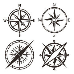 Obraz premium Four distinct compasses showcasing various designs and orientations Vector