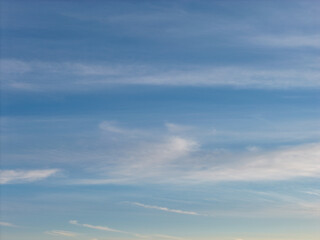 Fototapeta premium Blue sky with delicate, high altitude cirrus clouds creating a tranquil, ethereal atmosphere perfect for background usage in port washington, new york