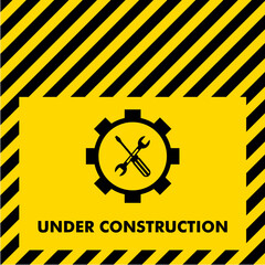 illustration of under construction sign with screwdriver and wrench on gear