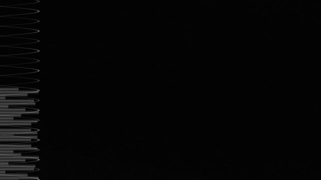 Vertical black and white composition featuring a series of spiral elements on a dark background