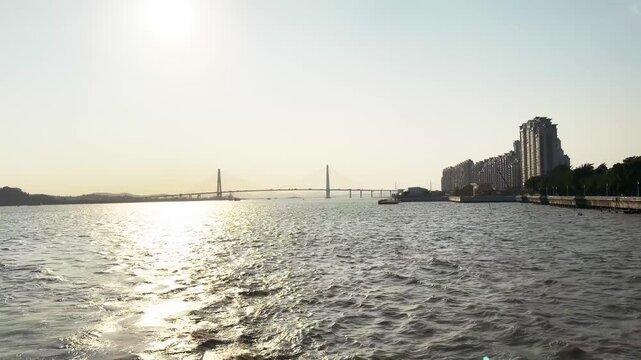 Zhanjiang Bay Bridge At Sunrise In China, Guangdong Province, Zhanjiang. Aerial Wide Shot