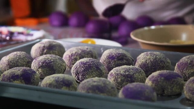 Filipino food called Ube cheese pandesal or bread with yam jam and cheese filling being prepared to be baked.