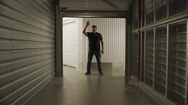 Garage door open close from darkness self storage facility
