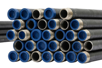 Stacked black industrial steel pipes with blue plastic end caps, close-up texture for construction supply catalog