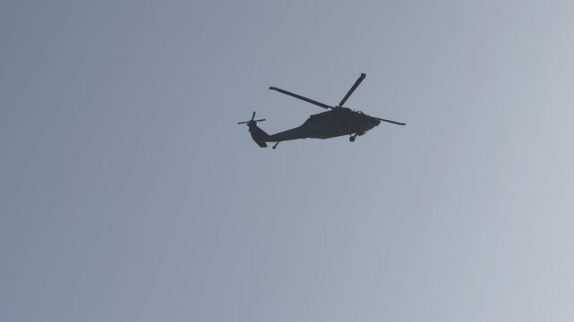  a military helicopter belonging to the Sikorsky H-60 Black Hawk family, specifically configured for naval or utility operations.